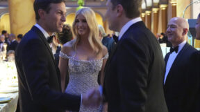 Elon Musk shakes hands with Jared Kushner as Ivanka Trump and Jeff Bezos watch.