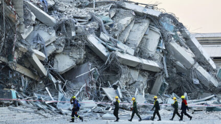 Rescuers work at the site a high-rise building under construction that collapsed after a 7.7 magnitude earthquake in Bangkok, Thailand, Friday, March 28, 2025. (AP Photo/Wason Wanichakorn)