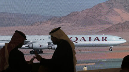 Plane carrying Qatari Emir Sheikh Tamim bin Hamad Al Thani on screen in Saudi Arabia