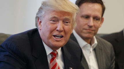 FILE - In this Wednesday, Dec. 14, 2016, file photo, PayPal founder Peter Thiel, right, listens as then President-elect Donald Trump speaks during a meeting with technology industry leaders at Trump Tower in New York. Thiel was able to gain New Zealand citizenship in 2011 despite never having lived in the country because a top lawmaker decided his entrepreneurial skills and philanthropy were valuable, documents reveal. Thiel didn't even have to leave California to become a new member of the South Pacific nation.