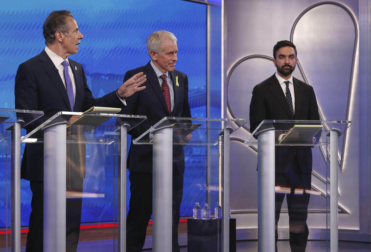 Democratic mayoral candidates Andrew Cuomo, far left, and Michael Blake present arguments as Whitney Tilson, second from left, and Zohran Mamdani look on during a Democratic mayoral primary debate, Wednesday, June 4, 2025, in New York.
