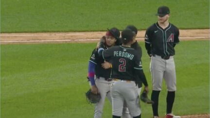Ketel Marte consoled by teammates