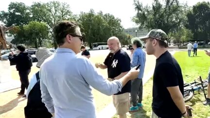 Trump Fan At Now-Removed Trump-Epstein Statue Says He Won't Release File 'Because He's On It'