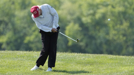Donald Trump golfing.