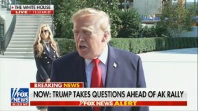trump with zacharia behind him